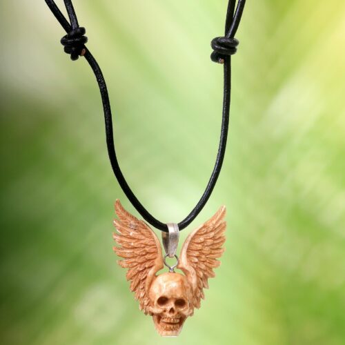 Hand Carved Bone Pendant Necklace of a Skull from Indonesia, 'Flying Skull'